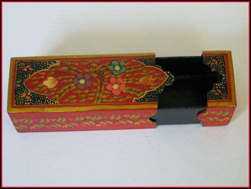 A Persian hand painted lacquer papier mache pen box. 15.5cm long