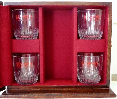 A Lined Wooden Display Box and Four Whisky Glasses