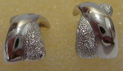 A Pair of Sterling Silver Earrings in the shape of a Cross