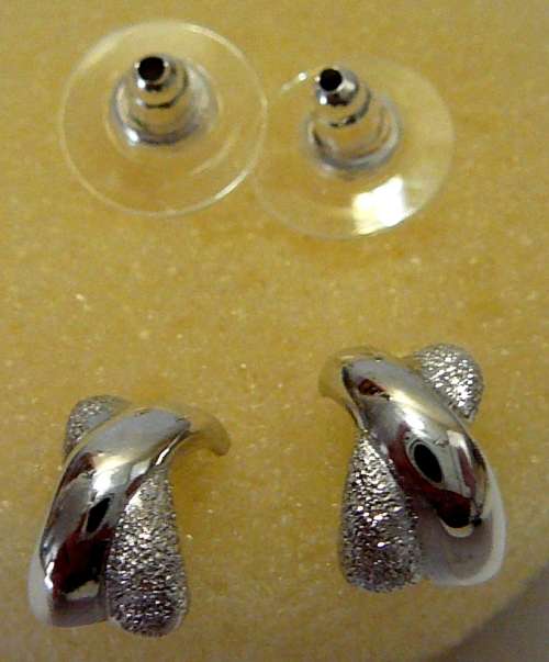 A Pair of Sterling Silver Earrings in the shape of a Cross