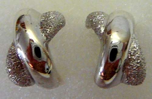 A Pair of Sterling Silver Earrings in the shape of a Cross