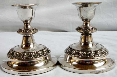 A Pair of Silver Plated Candle Holders by IANTHE