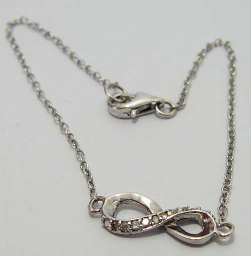 A Fine Sterling Silver Bracelet Chain with Figure 8 Set with CZ's
