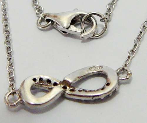A Fine Sterling Silver Bracelet Chain with Figure 8 Set with CZ's