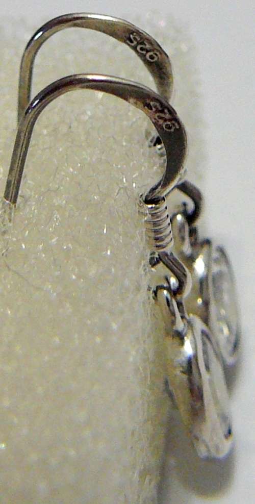 A Pair Sterling Silver Earrings set With Oval Cut Brilliant CZ's