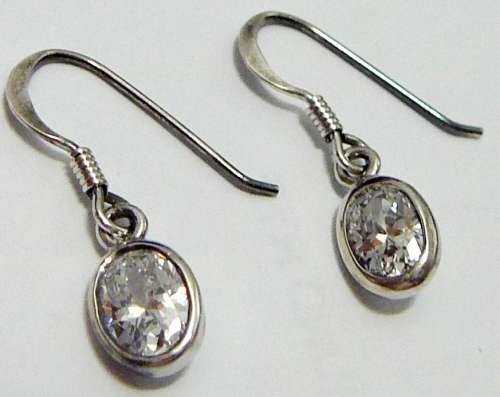 A Pair Sterling Silver Earrings set With Oval Cut Brilliant CZ's