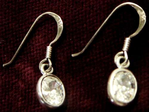 A Pair Sterling Silver Earrings set With Oval Cut Brilliant CZ's