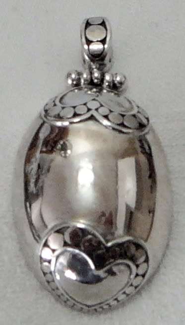 An Unusual Oval Sterling Silver Pendant