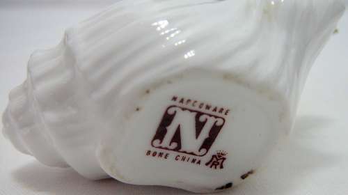 Gorgeous delicate Porcelain Pink Flowers in a White Snail Shell