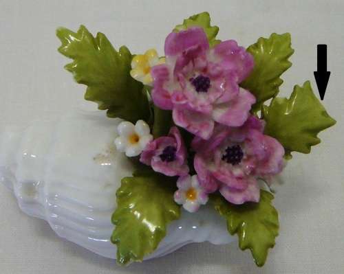 Gorgeous delicate Porcelain Pink Flowers in a White Snail Shell