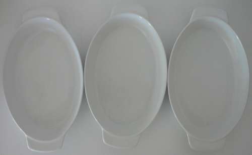 A trio of White oval Vegetable Serving Dishes