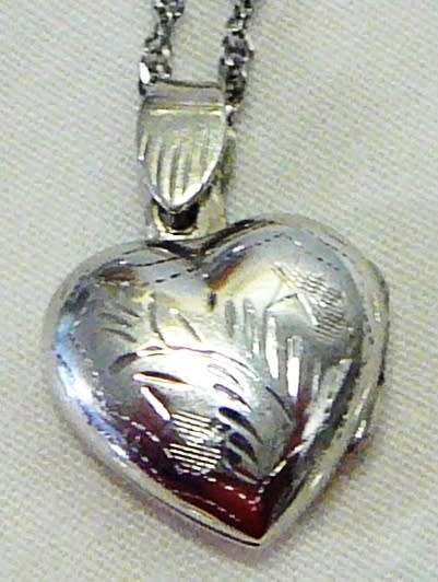 A Beautiful Sterling Silver Heart Shaped Locket and Chain