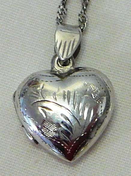 A Beautiful Sterling Silver Heart Shaped Locket and Chain