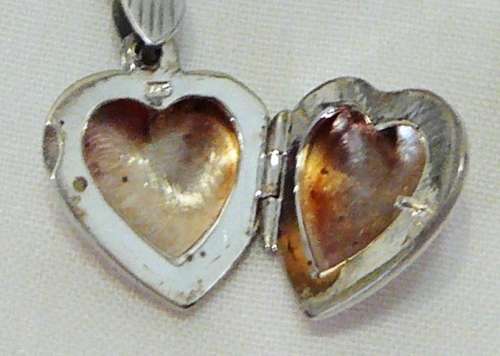 A Beautiful Sterling Silver Heart Shaped Locket and Chain