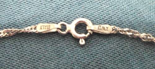 A Beautiful Sterling Silver Heart Shaped Locket and Chain