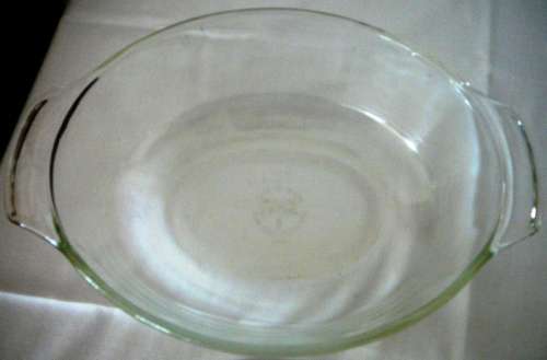 An Anchor Hocking Oval Casserole Dish in Stainless Steel Stand
