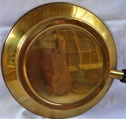 A Brass Bed Warmer With Wooden Handle