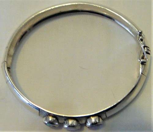 A Very Tasteful Sterling Silver Bangle set with a White Opal & 2 Precious Opals