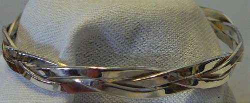 A Very Attractive Silver Bangle of Three Intertwined Bands.