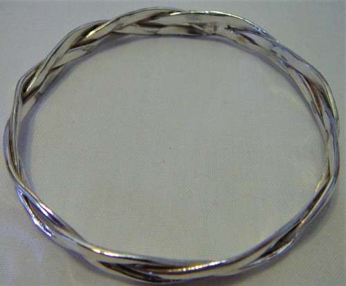A Very Attractive Silver Bangle of Three Intertwined Bands.