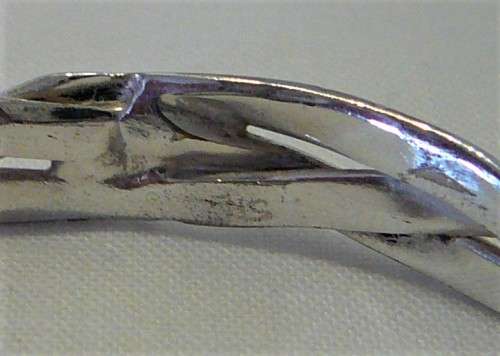 A Very Attractive Silver Bangle of Three Intertwined Bands.