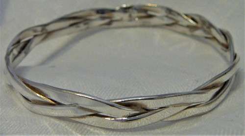 A Very Attractive Silver Bangle of Three Intertwined Bands.