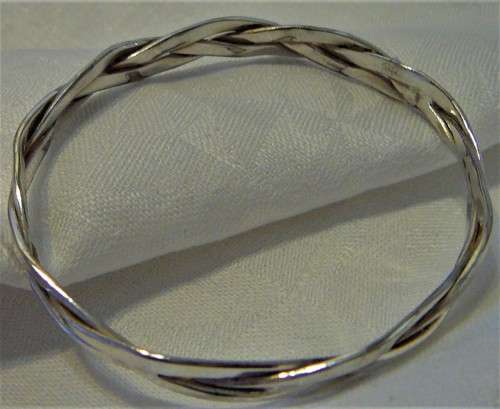 A Very Attractive Silver Bangle of Three Intertwined Bands.