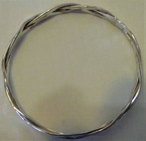 A Very Attractive Silver Bangle of Three Intertwined Bands.