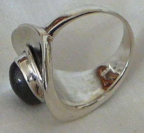 A Beautiful Sterling Silver Ring set with a Cabuchon Cut Lupis Stone