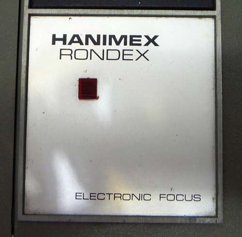 A Hanimex Rondex Slide Projector with 4 Slide Cartridges