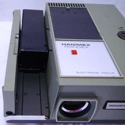 A Hanimex Rondex Slide Projector with 4 Slide Cartridges