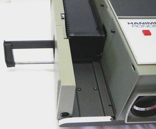 A Hanimex Rondex Slide Projector with 4 Slide Cartridges