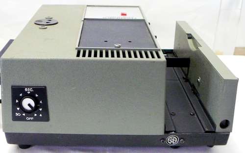 A Hanimex Rondex Slide Projector with 4 Slide Cartridges
