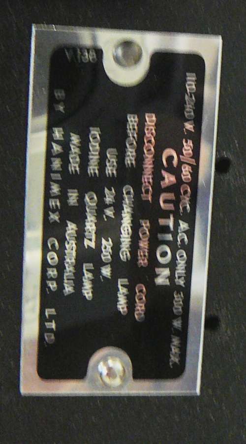 A Hanimex Rondex Slide Projector with 4 Slide Cartridges