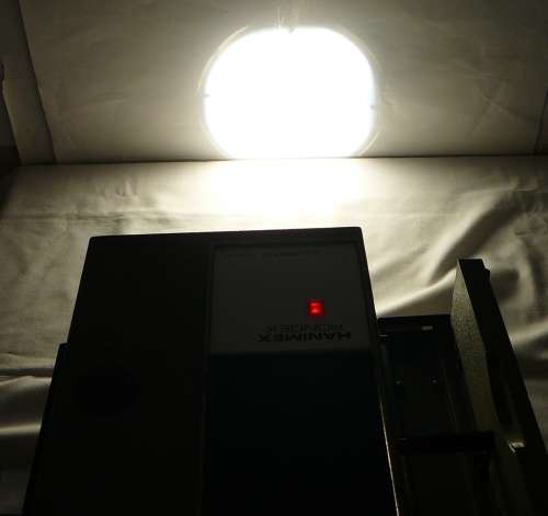 A Hanimex Rondex Slide Projector with 4 Slide Cartridges