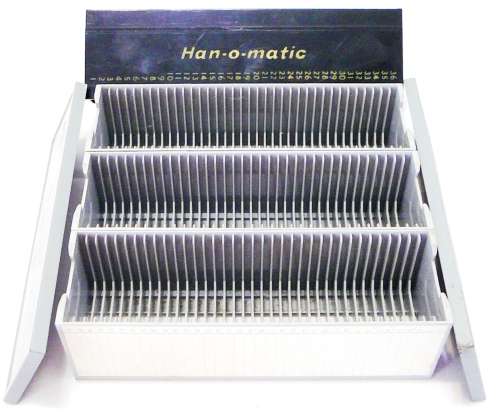 A Hanimex Rondex Slide Projector with 4 Slide Cartridges