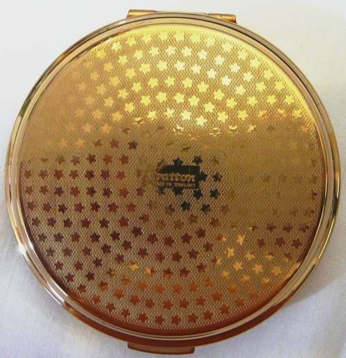 An Unused Convertible Powder Compact by Stratton