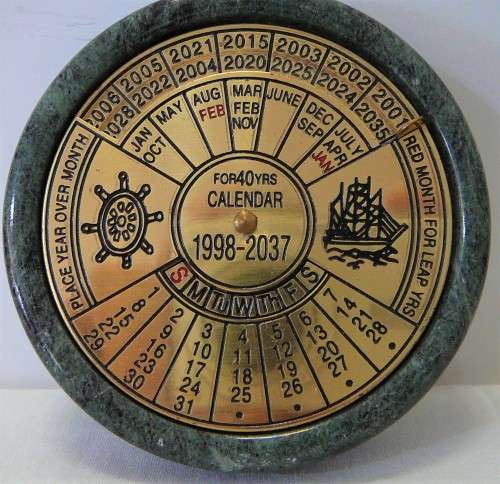 A 40 Year (1998-2037) Perpetual Calandar Set into a Green Marble Base