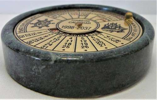 A 40 Year (1998-2037) Perpetual Calandar Set into a Green Marble Base