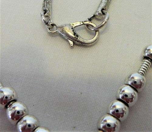 Interesting Long Pendant of Simulated Pearls and Baubles on Silver Coloured Chain