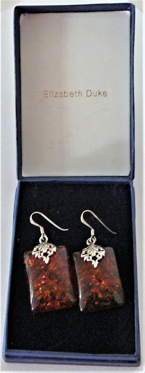 A Charmin Pair of Amber Earrings set in Sterling Silver