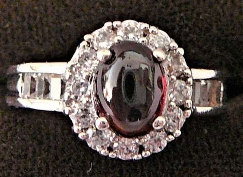 A Stunning Sterling Silver Ring set with a Garnet Coloured CZ