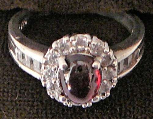 A Stunning Sterling Silver Ring set with a Garnet Coloured CZ