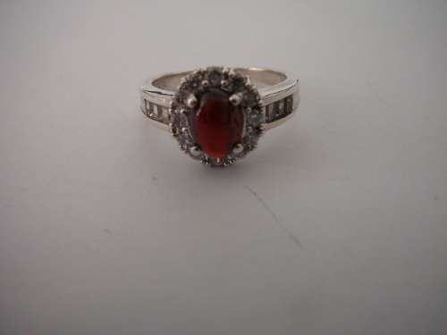 A Stunning Sterling Silver Ring set with a Garnet Coloured CZ