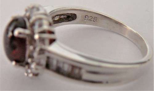 A Stunning Sterling Silver Ring set with a Garnet Coloured CZ