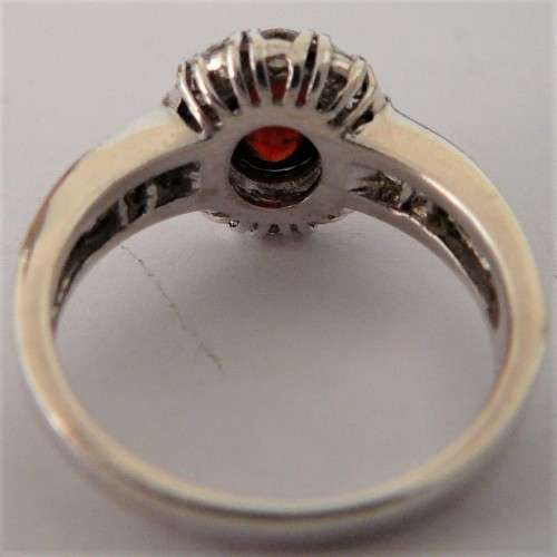 A Stunning Sterling Silver Ring set with a Garnet Coloured CZ