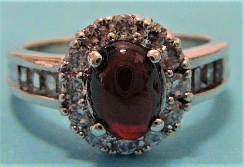 A Stunning Sterling Silver Ring set with a Garnet Coloured CZ
