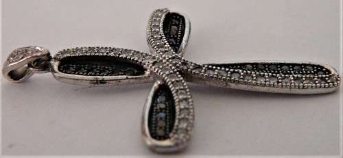 A Very attractive Sterling Silver Cross set with Black and White CZ's