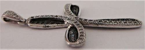 A Very attractive Sterling Silver Cross set with Black and White CZ's