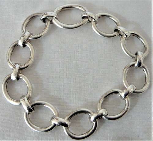A Silver Bracelet of Hollow Silver Rings with an Unusual Hinged Ring Clasp